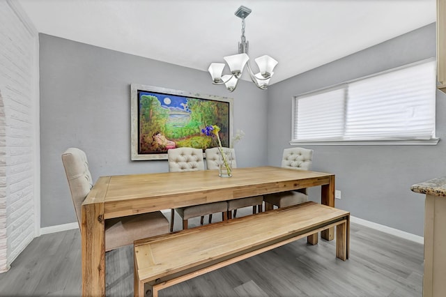 7530 Deep Forest Dr, Houston, TX 77088 - dining room featuring a chandelier and wood finished floors