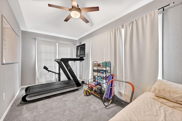 7530 Deep Forest Dr, Houston, TX 77088 - workout room featuring ceiling fan and carpet floors