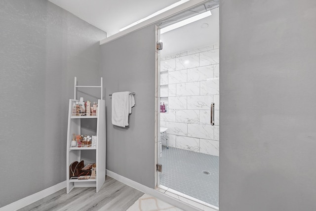 7530 Deep Forest Dr, Houston, TX 77088 - full bathroom featuring a stall shower and wood finished floors