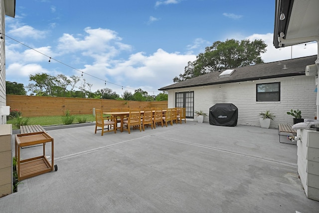 7530 Deep Forest Dr, Houston, TX 77088 - view of patio with a grill and outdoor dining area