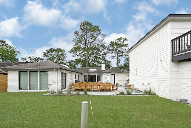 7530 Deep Forest Dr, Houston, TX 77088 - back of house featuring a lawn, an outdoor hangout area, roof with shingles, and a patio area