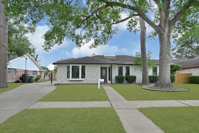 7530 Deep Forest Dr, Houston, TX 77088 - single story home with driveway, stone siding, and roof with shingles
