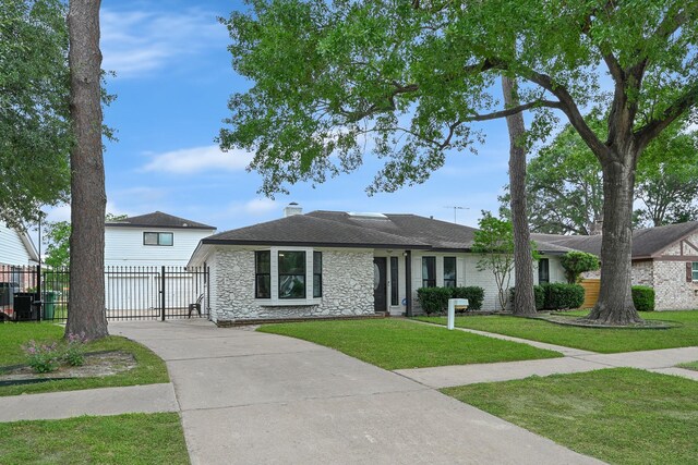 7530 Deep Forest Dr, Houston, TX 77088 - view of front of house with stone siding, a gate, driveway, a shingled roof, and a chimney