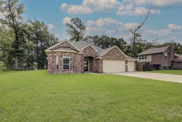 285 Rd 66121, Dayton, TX 77535 - view of front of home featuring concrete driveway, a garage, and brick siding