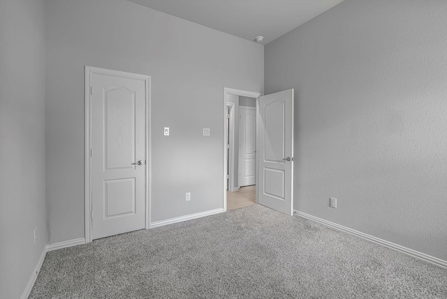 285 Rd 66121, Dayton, TX 77535 - unfurnished bedroom with light carpet and baseboards
