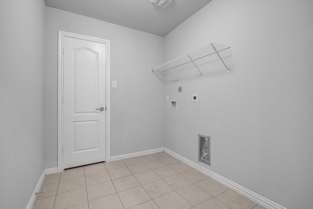 285 Rd 66121, Dayton, TX 77535 - laundry area with hookup for an electric dryer, washer hookup, and light tile patterned floors