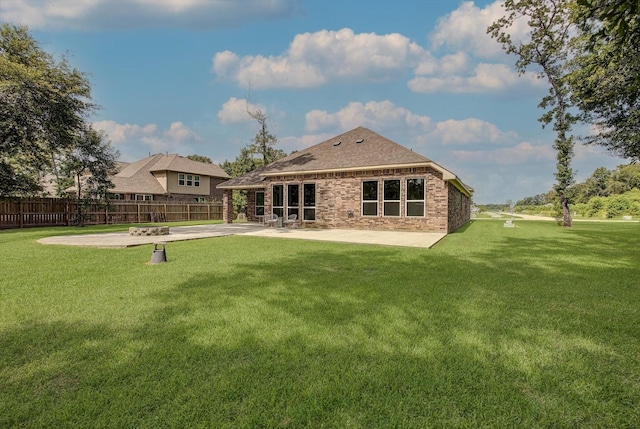 285 Rd 66121, Dayton, TX 77535 - rear view of property with a patio area, brick siding, and a shingled roof
