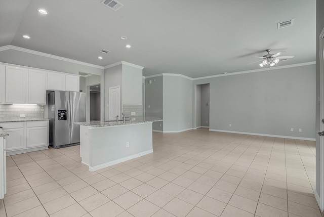 285 Rd 66121, Dayton, TX 77535 - kitchen with stainless steel fridge, crown molding, tasteful backsplash, a ceiling fan, and recessed lighting