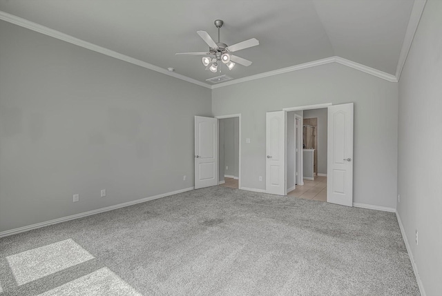 285 Rd 66121, Dayton, TX 77535 - unfurnished bedroom featuring light carpet, crown molding, lofted ceiling, and ceiling fan