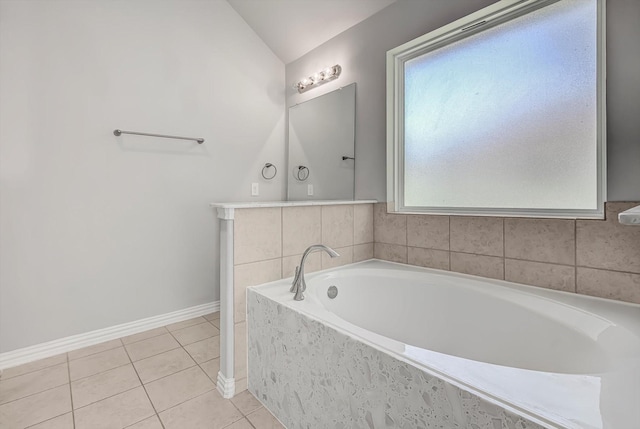 285 Rd 66121, Dayton, TX 77535 - bathroom with lofted ceiling, a bath, and tile patterned flooring