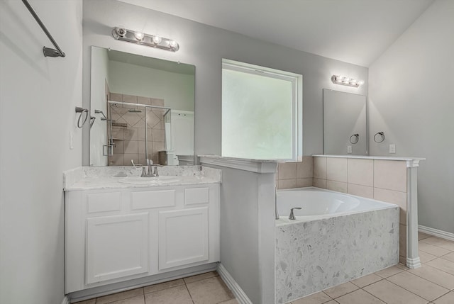 285 Rd 66121, Dayton, TX 77535 - full bathroom featuring tile patterned floors, a garden tub, vanity, and tiled shower