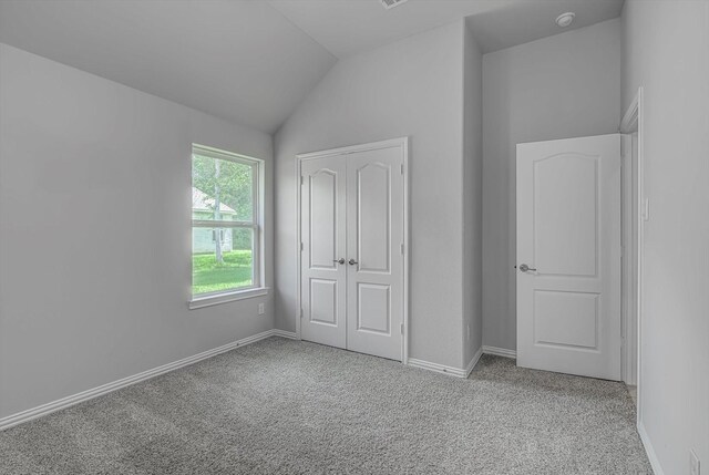 285 Rd 66121, Dayton, TX 77535 - unfurnished bedroom with vaulted ceiling and carpet
