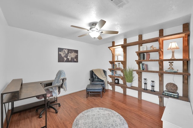 27237 Lana Ln, Conroe, TX 77385 - office space with a ceiling fan, wood finished floors, and a textured ceiling