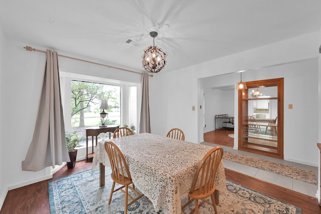 27237 Lana Ln, Conroe, TX 77385 - dining space with a chandelier and wood finished floors