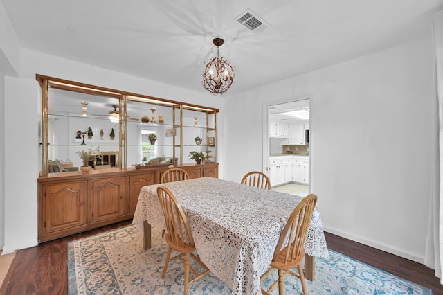 27237 Lana Ln, Conroe, TX 77385 - dining area with a chandelier and wood finished floors