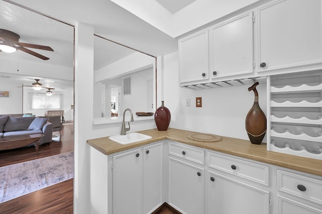 27237 Lana Ln, Conroe, TX 77385 - kitchen featuring ceiling fan, light countertops, and white cabinets