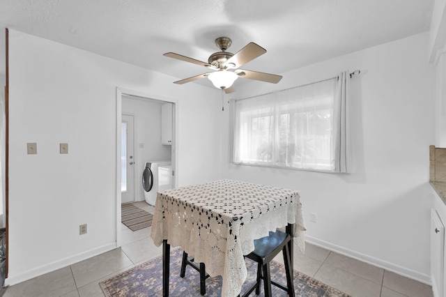 27237 Lana Ln, Conroe, TX 77385 - dining room featuring washer / dryer, light tile patterned floors, and a ceiling fan