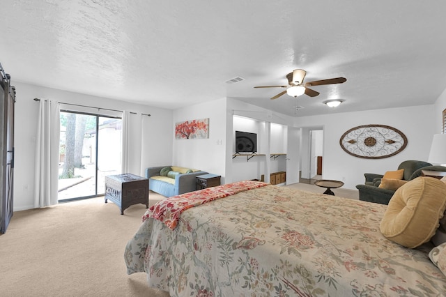27237 Lana Ln, Conroe, TX 77385 - carpeted bedroom with access to outside, a textured ceiling, and ceiling fan