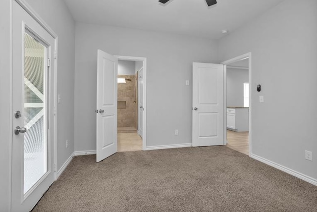 16850 Glenheath, Montgomery, TX 77316 - unfurnished bedroom featuring light carpet, ensuite bathroom, and a ceiling fan