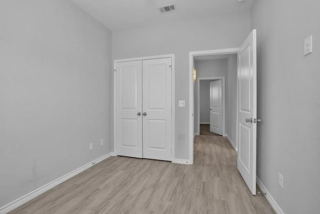 16850 Glenheath, Montgomery, TX 77316 - unfurnished bedroom with light wood finished floors and a closet