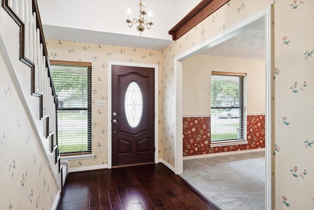 16810 Methil Dr, Spring, TX 77379 - entrance foyer with wallpapered walls, a chandelier, hardwood / wood-style flooring, and stairs