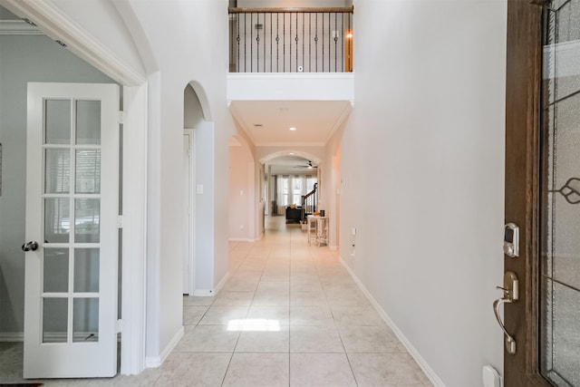 18002 Quarry Vale Dr, Cypress, TX 77429 - tiled entryway featuring arched walkways and crown molding