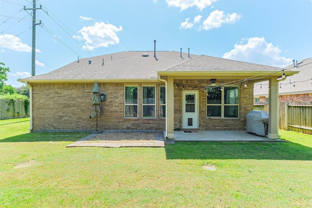 18002 Quarry Vale Dr, Cypress, TX 77429 - back of property featuring a patio area, a ceiling fan, brick siding, and a shingled roof
