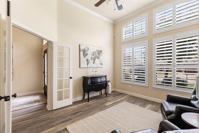 12015 Obsidian Ln, Dayton, TX 77535 - living area featuring a ceiling fan, ornamental molding, a towering ceiling, wood finished floors, and french doors