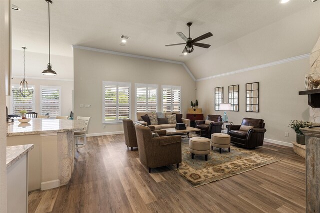 12015 Obsidian Ln, Dayton, TX 77535 - living room with a ceiling fan, wood finished floors, ornamental molding, and lofted ceiling