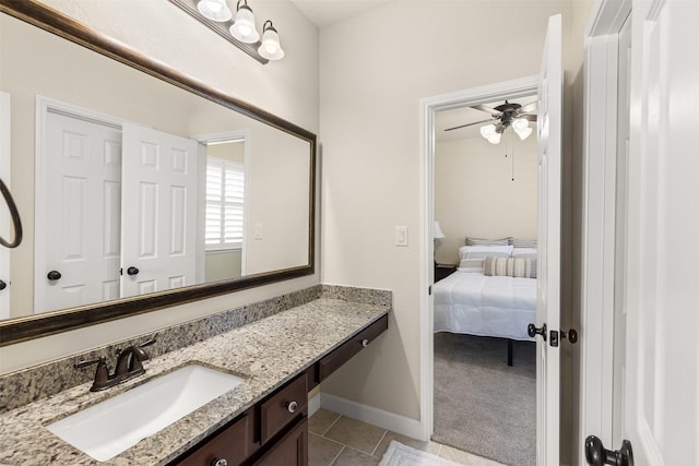 12015 Obsidian Ln, Dayton, TX 77535 - bathroom featuring vanity, ensuite bathroom, ceiling fan, and tile patterned flooring
