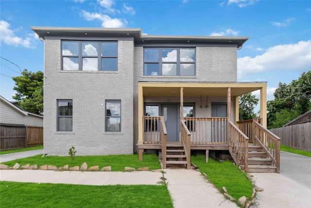 102 Glendale St, Houston, TX 77012 - view of front facade featuring brick siding and a porch