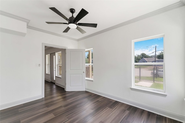 102 Glendale St, Houston, TX 77012 - spare room featuring dark wood-style floors, ornamental molding, and ceiling fan
