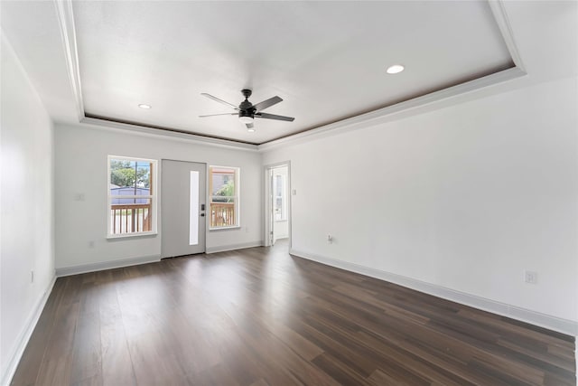 102 Glendale St, Houston, TX 77012 - spare room with a ceiling fan, dark wood-style flooring, recessed lighting, and a raised ceiling