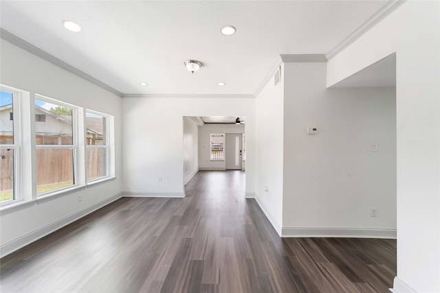 102 Glendale St, Houston, TX 77012 - empty room featuring crown molding, plenty of natural light, dark wood-style floors, recessed lighting, and a ceiling fan