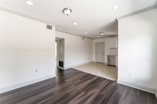 102 Glendale St, Houston, TX 77012 - unfurnished living room with recessed lighting, dark wood finished floors, and crown molding