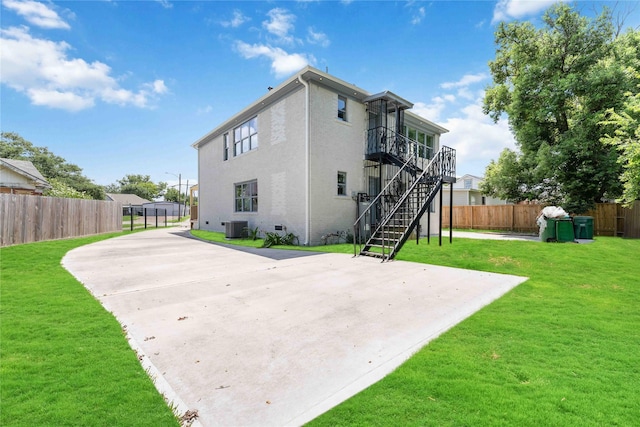 102 Glendale St, Houston, TX 77012 - back of property with stairway, a patio, and stucco siding