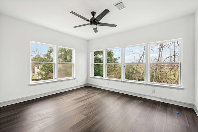 102 Glendale St, Houston, TX 77012 - spare room featuring a ceiling fan and dark wood finished floors