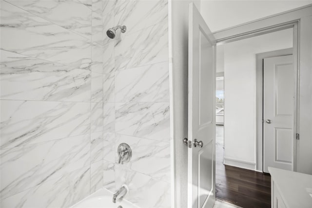 102 Glendale St, Houston, TX 77012 - bathroom with shower / tub combination, wood finished floors, and vanity