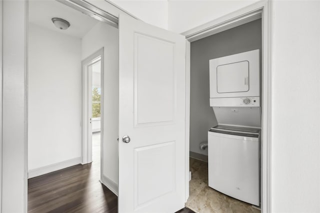 102 Glendale St, Houston, TX 77012 - laundry room with stacked washer / drying machine and dark wood-style flooring