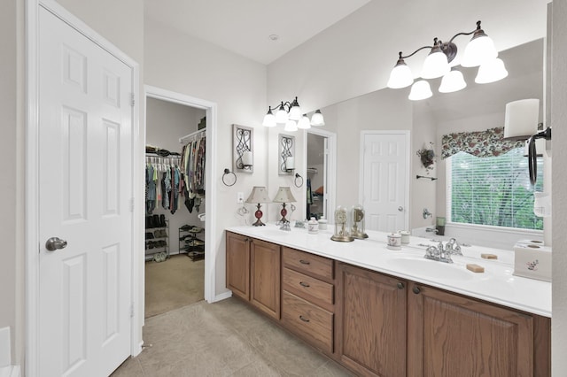 30302 Castle Forest Dr, Spring, TX 77386 - bathroom featuring double vanity, a walk in closet, and tile patterned flooring