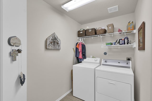 30302 Castle Forest Dr, Spring, TX 77386 - laundry room featuring separate washer and dryer and light tile patterned floors