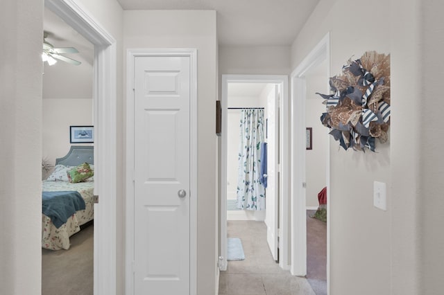 30302 Castle Forest Dr, Spring, TX 77386 - hallway with light tile patterned floors and light carpet