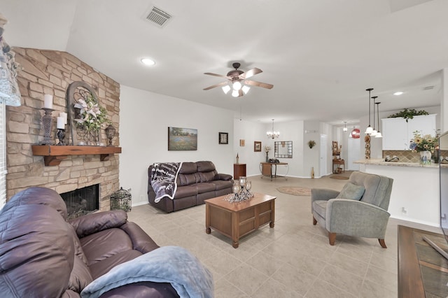 30302 Castle Forest Dr, Spring, TX 77386 - living area featuring ceiling fan, light tile patterned floors, a stone fireplace, a chandelier, and recessed lighting