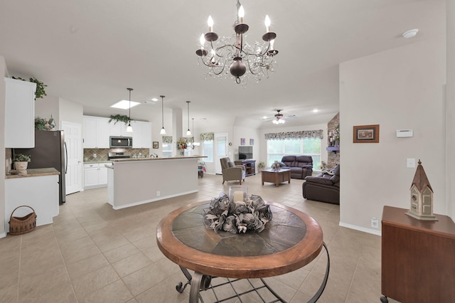 30302 Castle Forest Dr, Spring, TX 77386 - dining space with light tile patterned floors, a chandelier, and a ceiling fan