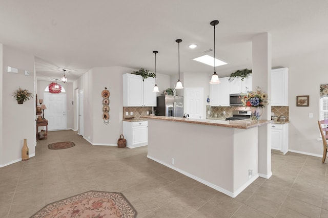 30302 Castle Forest Dr, Spring, TX 77386 - kitchen featuring appliances with stainless steel finishes, backsplash, white cabinets, and recessed lighting