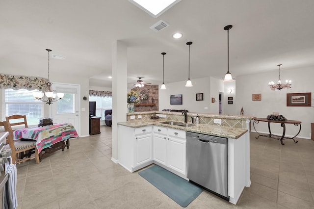 30302 Castle Forest Dr, Spring, TX 77386 - kitchen featuring stainless steel dishwasher, a chandelier, light tile patterned flooring, light stone countertops, and recessed lighting