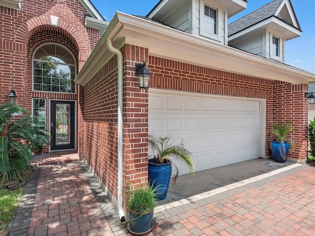 11938 Galentine Pt, Cypress, TX 77429 - property entrance featuring brick siding, driveway, and an attached garage