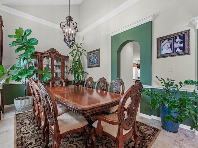 11938 Galentine Pt, Cypress, TX 77429 - dining area featuring arched walkways, a towering ceiling, a chandelier, and crown molding