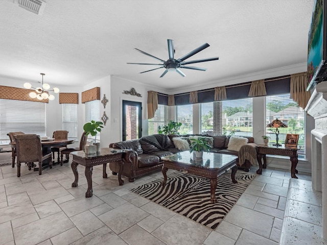 11938 Galentine Pt, Cypress, TX 77429 - living room with a chandelier, ceiling fan, and a textured ceiling