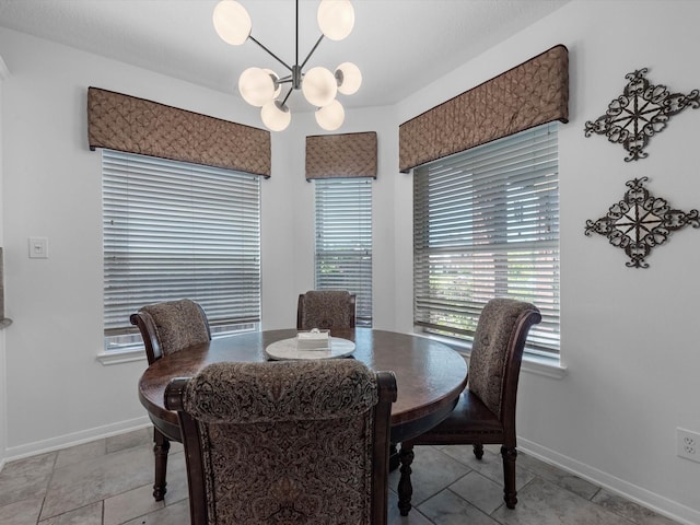 11938 Galentine Pt, Cypress, TX 77429 - dining area featuring a chandelier and baseboards